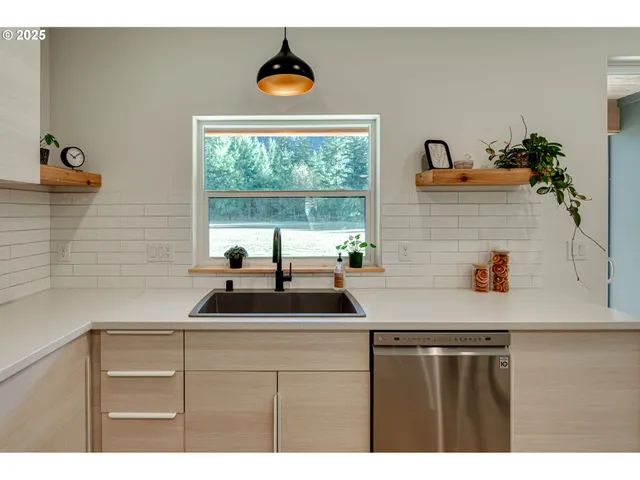 a kitchen with a sink and a window