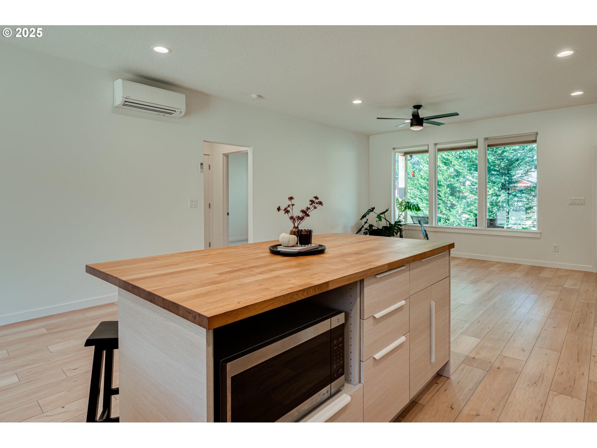 192 Stuart Field Lane Ariel, WA 98603 - Photo 8 of 35 a kitchen with kitchen island a sink table and chairs