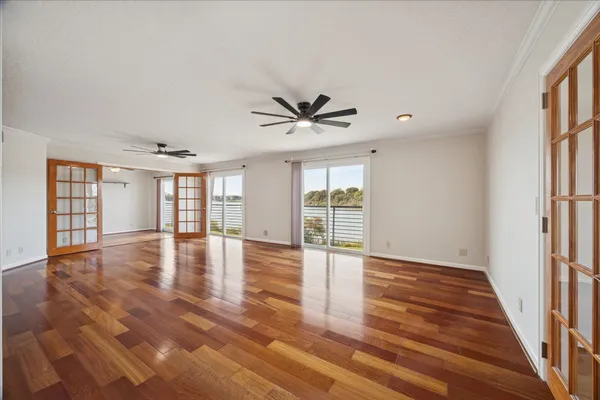 wooden floor in an empty room with a window