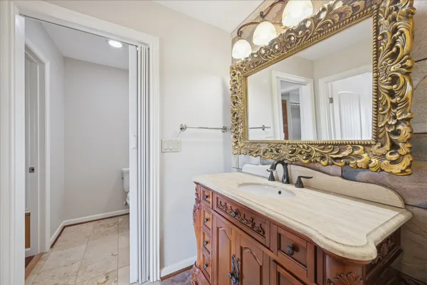 a bathroom with a sink and a mirror