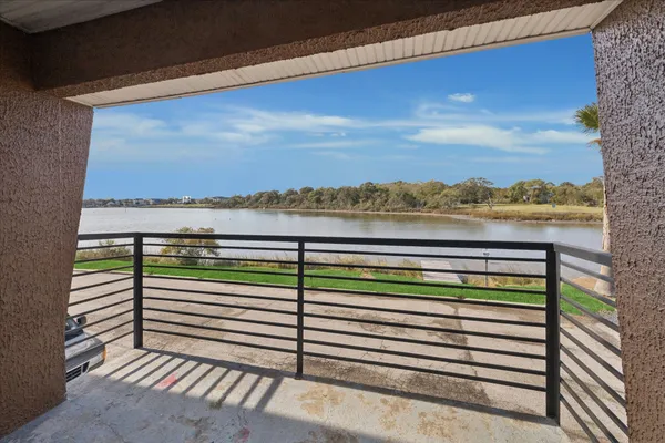 a view of a balcony with lake view and mountain view