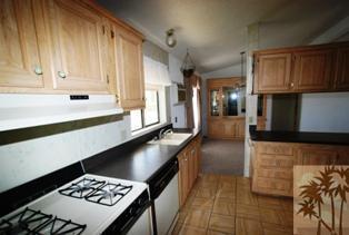 59350 Rocky Ravine Road Anza, CA 92539 - Photo 8 of 15 a kitchen with stainless steel appliances sinks a stove and cabinets