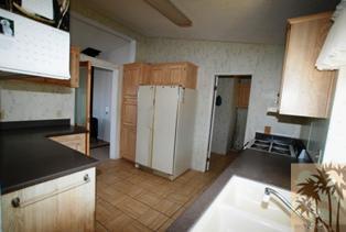 59350 Rocky Ravine Road Anza, CA 92539 - Photo 9 of 15 a kitchen with a refrigerator and a stove