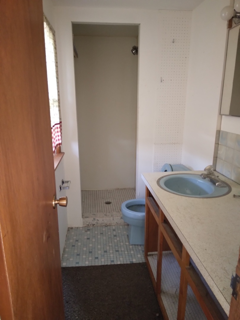 2201 Root Street Crest Hill, IL 60403 - Photo 16 of 27 a bathroom with a sink toilet and shower