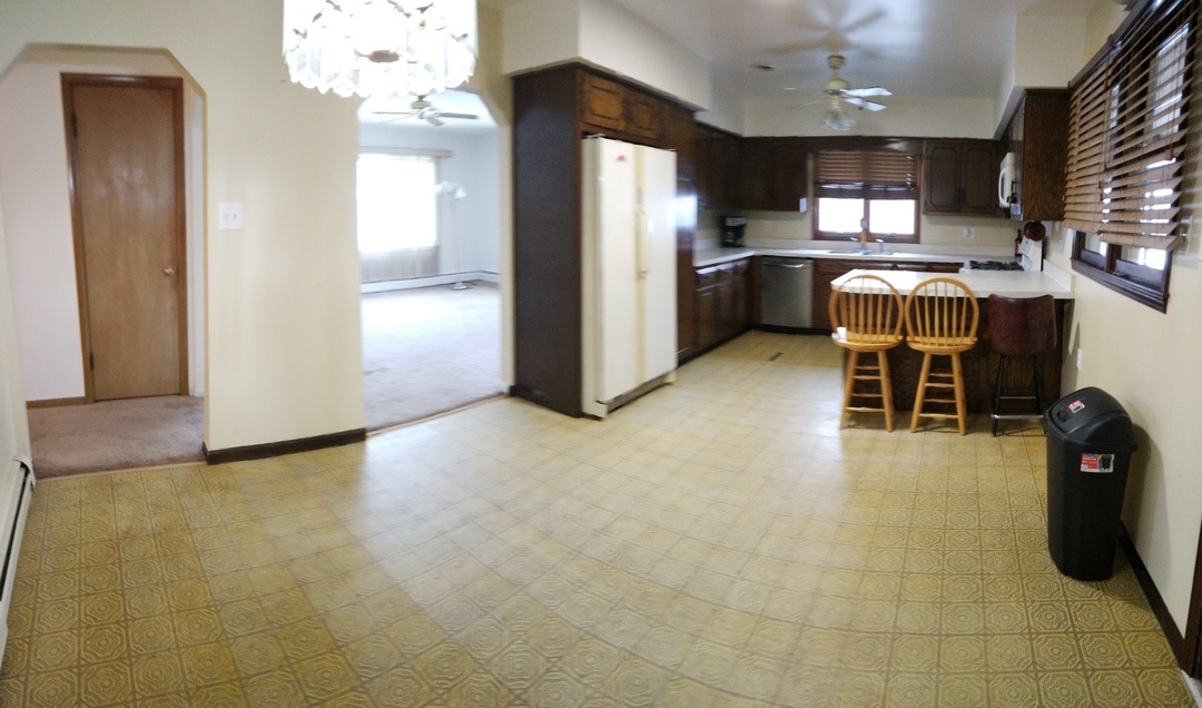 2201 Root Street Crest Hill, IL 60403 - Photo 6 of 27 a view of kitchen with refrigerator cabinets and furniture