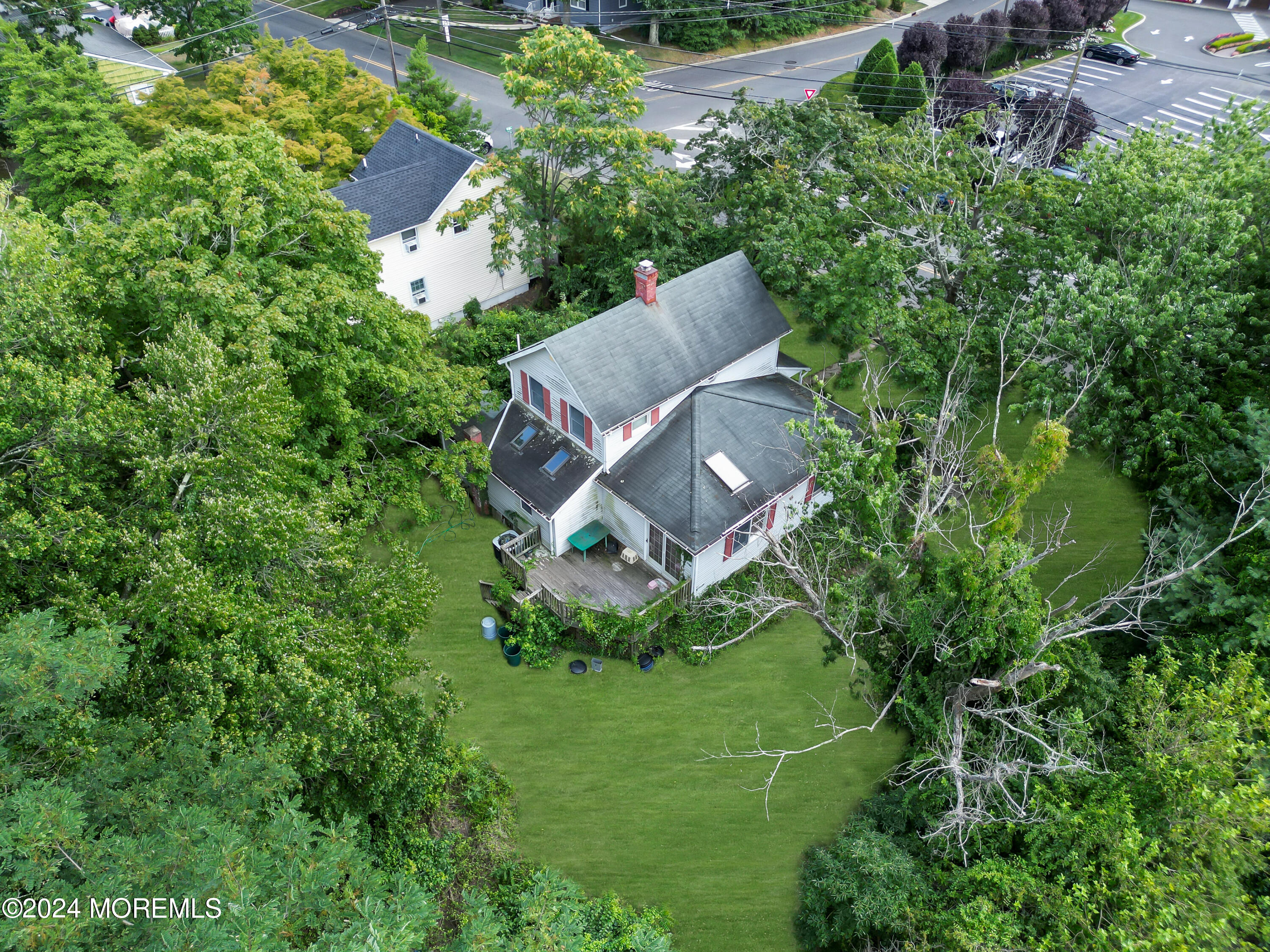 1302 Ocean Road Spring Lake Heights, NJ 07762 - Photo 2 of 6 an aerial view of a house with a yard and trees all around