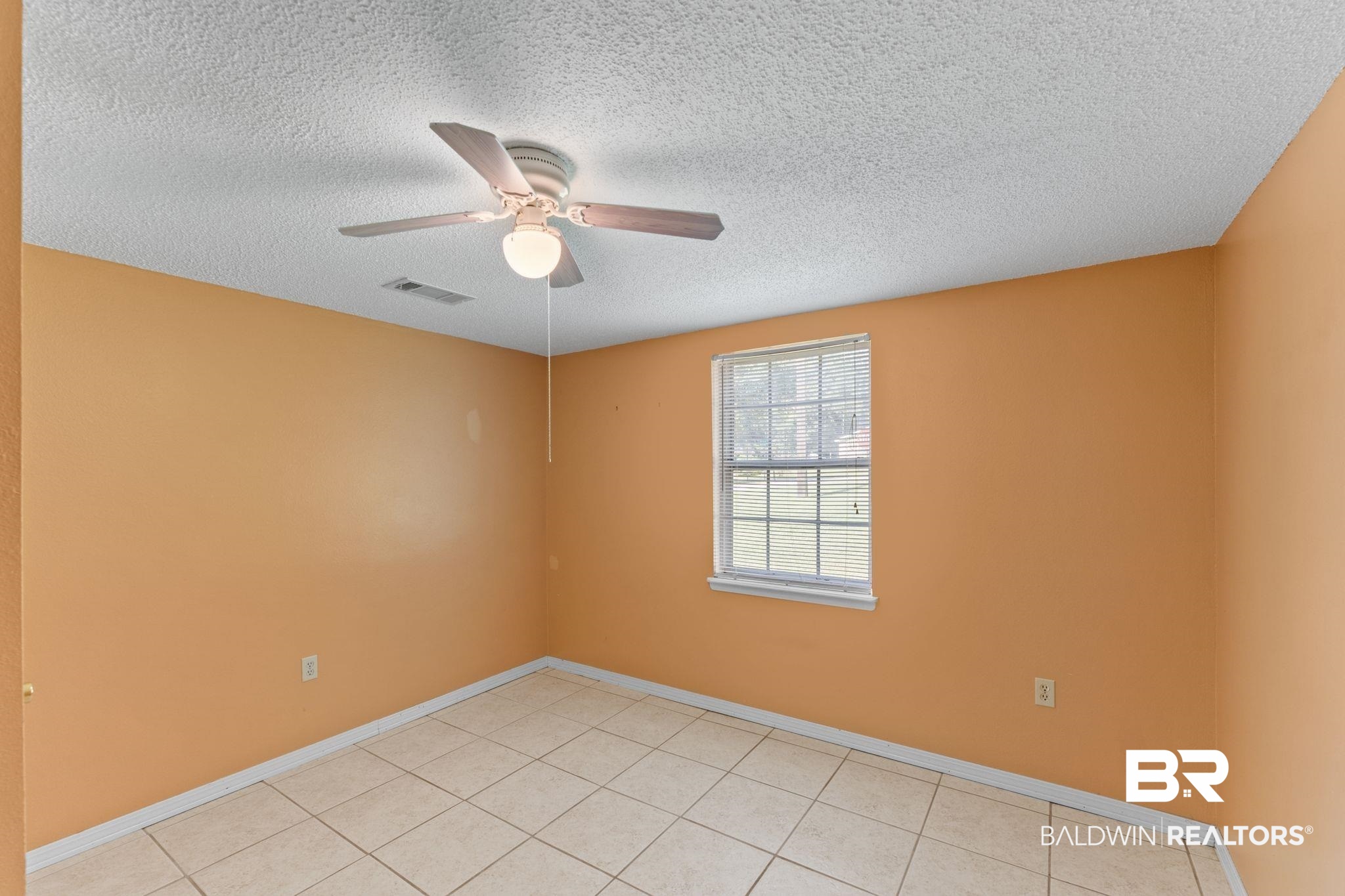 14095 Riverside Drive Foley, AL 36535 - Photo 16 of 30 Unfurnished room with ceiling fan, a textured ceiling, and light tile patterned flooring