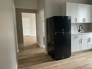 a view of a kitchen from the hallway