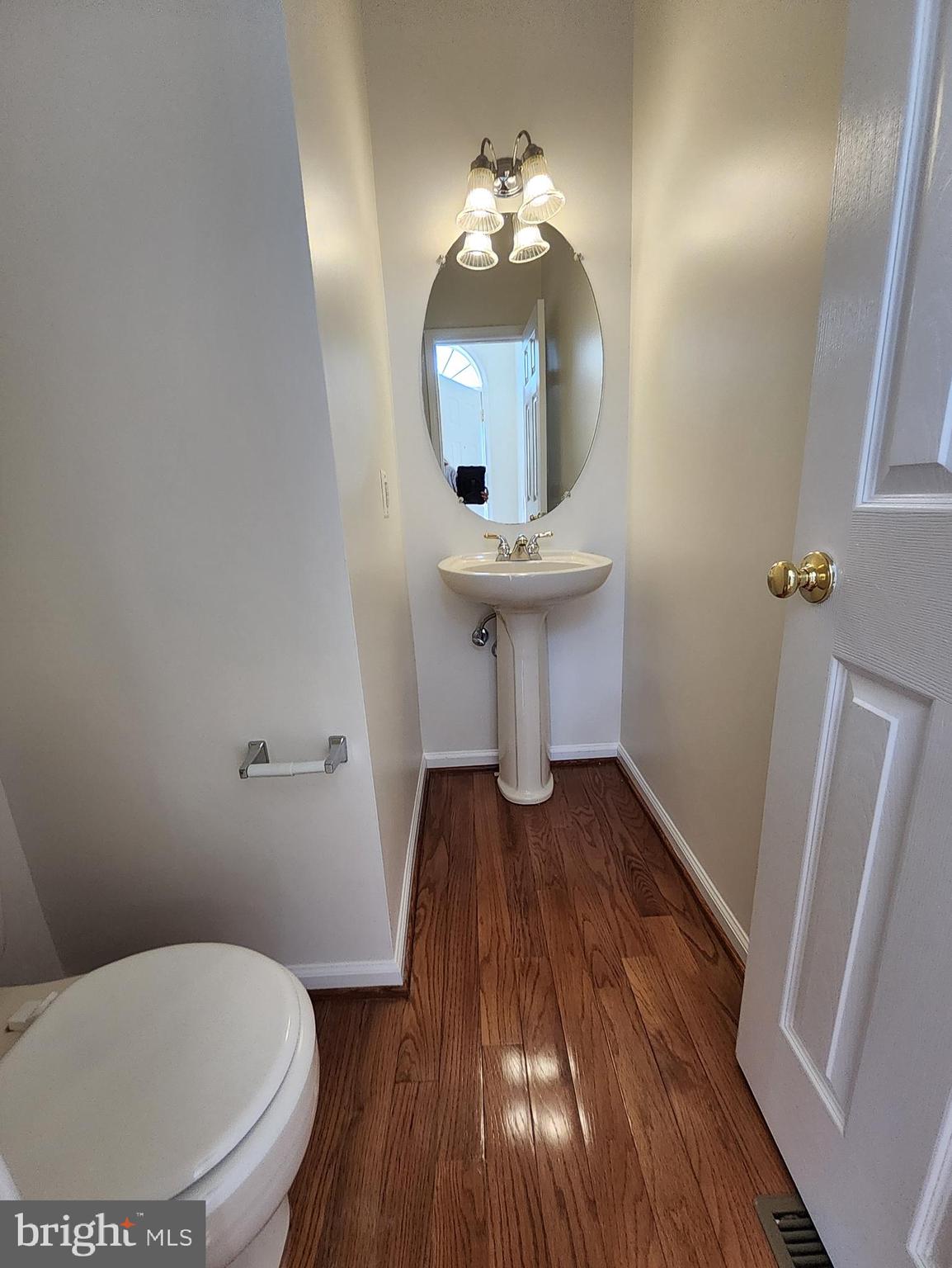 20939 Calais Terrace Ashburn, VA 20147 - Photo 12 of 31 a bathroom with a toilet sink and mirror