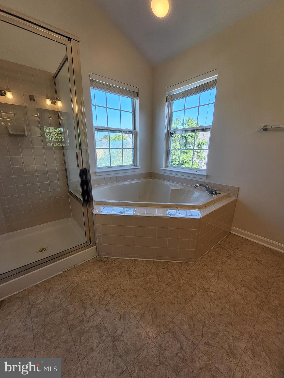 20939 Calais Terrace Ashburn, VA 20147 - Photo 16 of 31 a view of water heater room with a bathtub