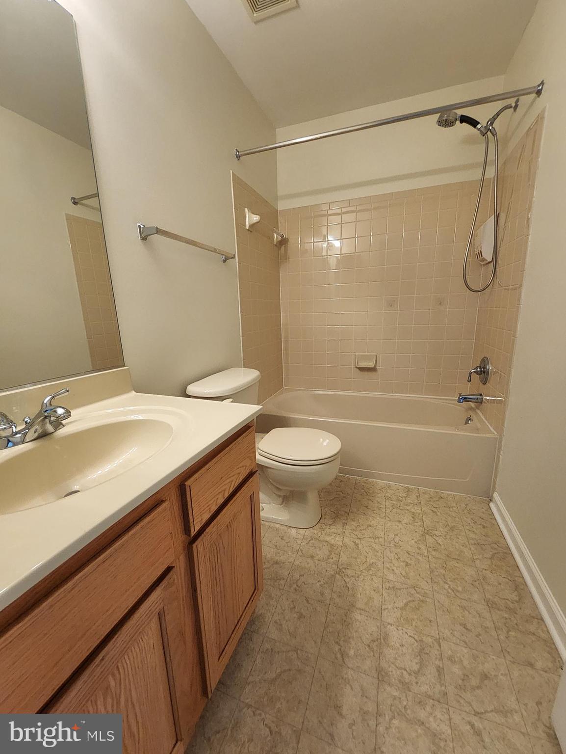 20939 Calais Terrace Ashburn, VA 20147 - Photo 20 of 31 a bathroom with a sink a toilet and shower
