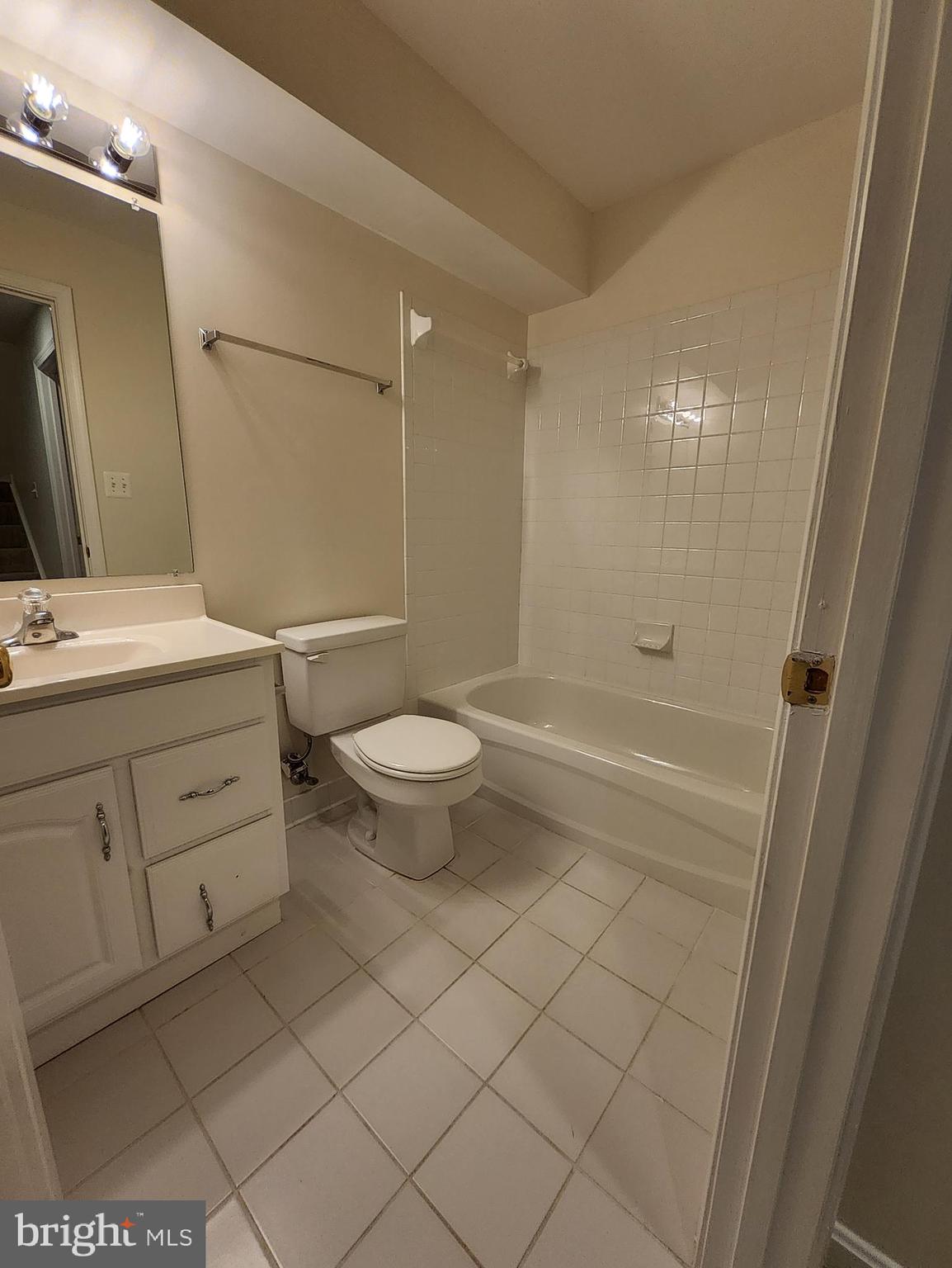20939 Calais Terrace Ashburn, VA 20147 - Photo 25 of 31 a bathroom with a granite countertop sink toilet and shower
