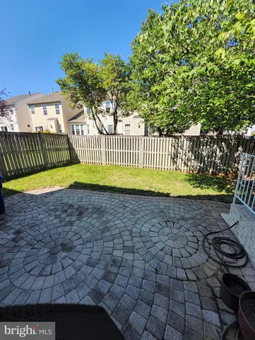 a view of a chair and table in the patio