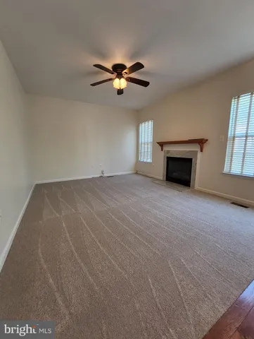 a view of empty room with windows