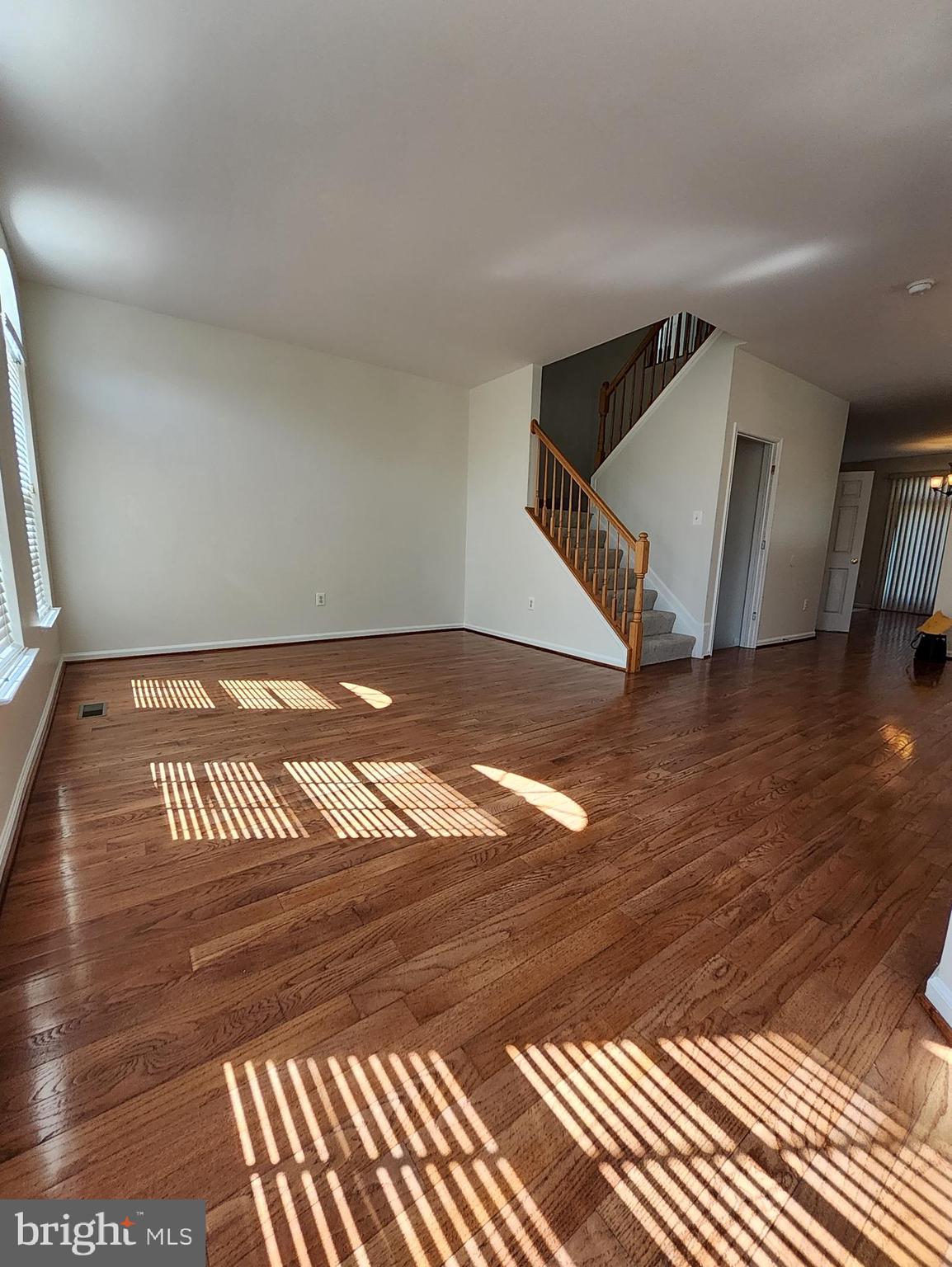 20939 Calais Terrace Ashburn, VA 20147 - Photo 10 of 31 a view of a room with wooden floor