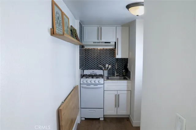 a kitchen with a stove and a microwave
