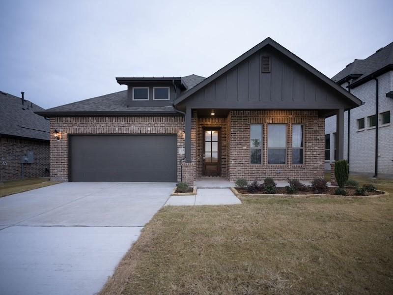 151 Winterwood Drive Lavon, TX 75166 - Photo 1 of 22 a front view of a house with a yard and garage
