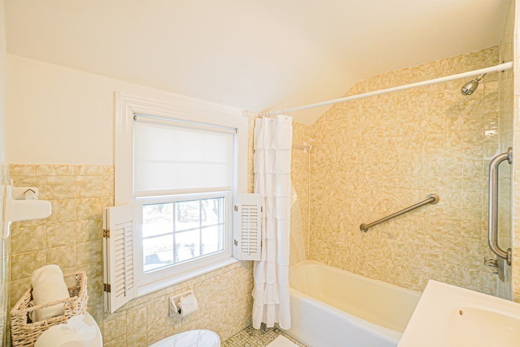 71 Pine Ridge Road Reading, MA 01867 - Photo 18 of 40 a bathroom with a bathtub and a shower