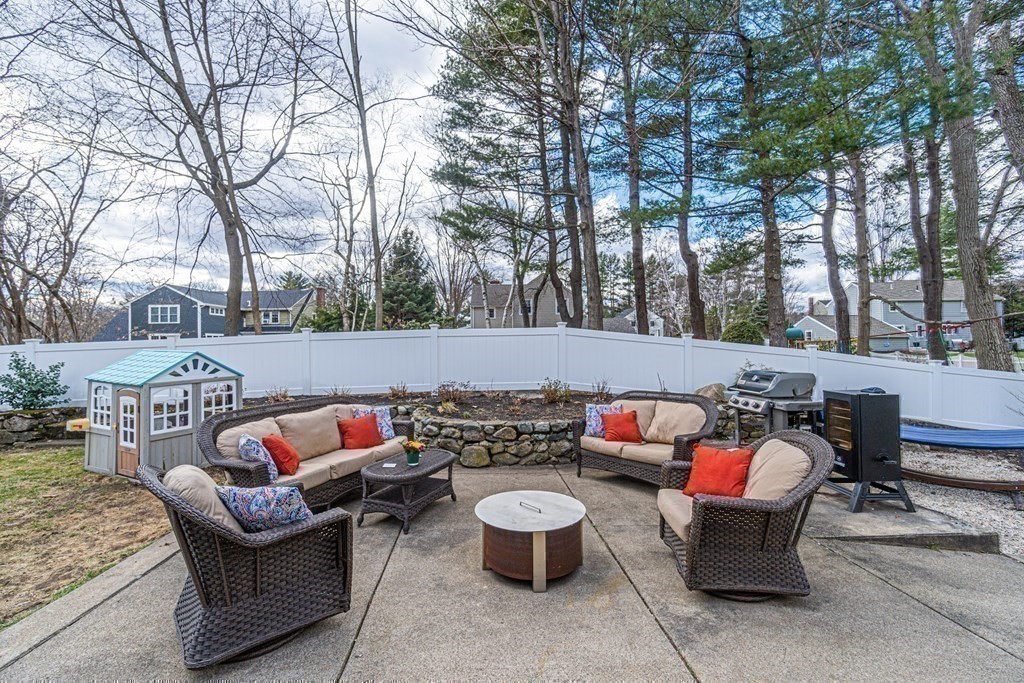 71 Pine Ridge Road Reading, MA 01867 - Photo 33 of 40 a backyard of a house with fire pit and outdoor seating