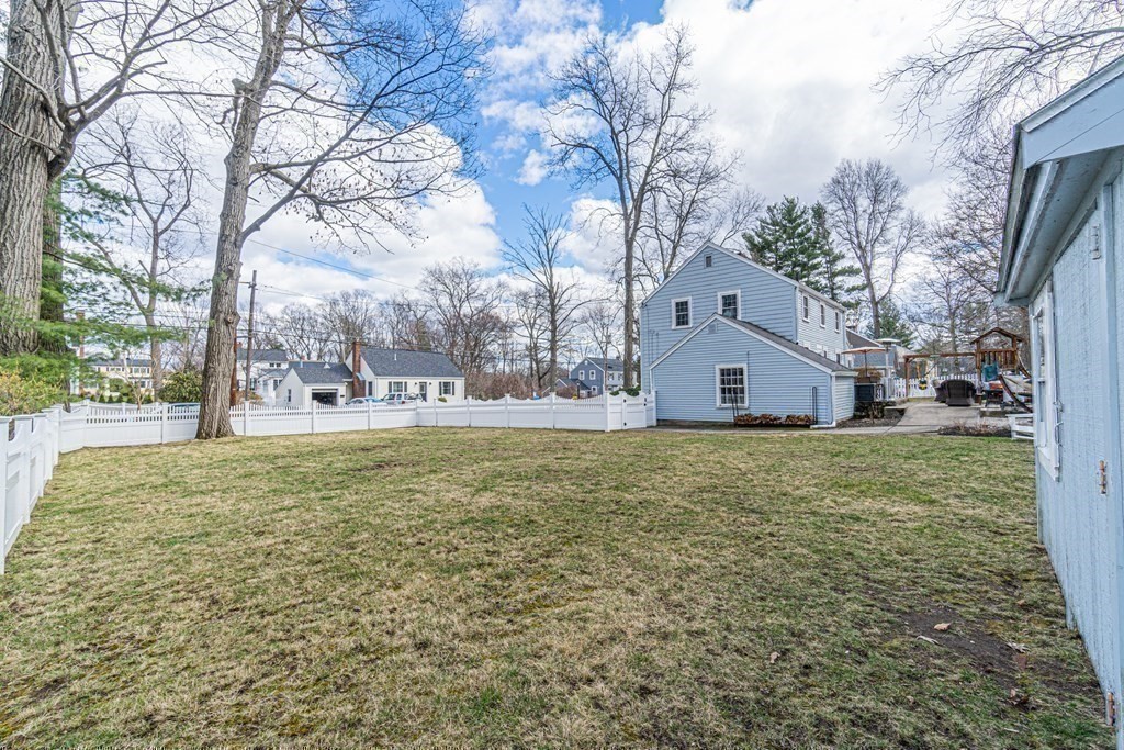 71 Pine Ridge Road Reading, MA 01867 - Photo 36 of 40 a view of a house with a yard