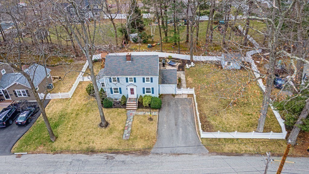 71 Pine Ridge Road Reading, MA 01867 - Photo 38 of 40 front view of a house with a yard