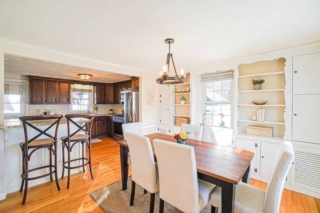 71 Pine Ridge Road Reading, MA 01867 - Photo 5 of 40 a view of a a dining room with furniture window and wooden floor