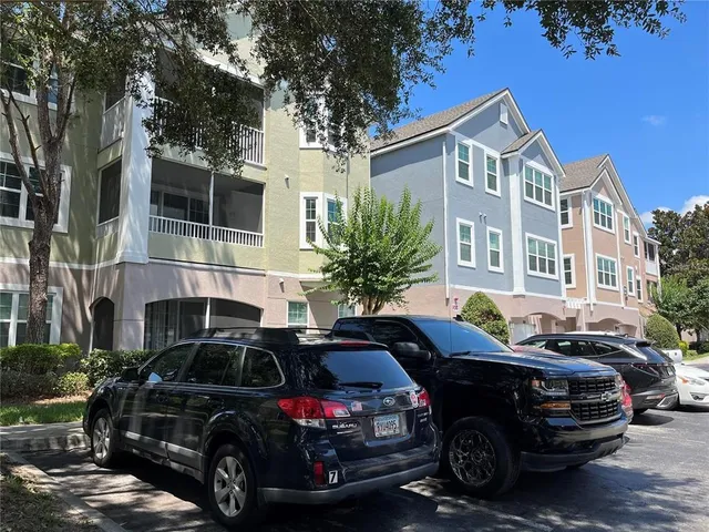 a view of a car parked in front of a house