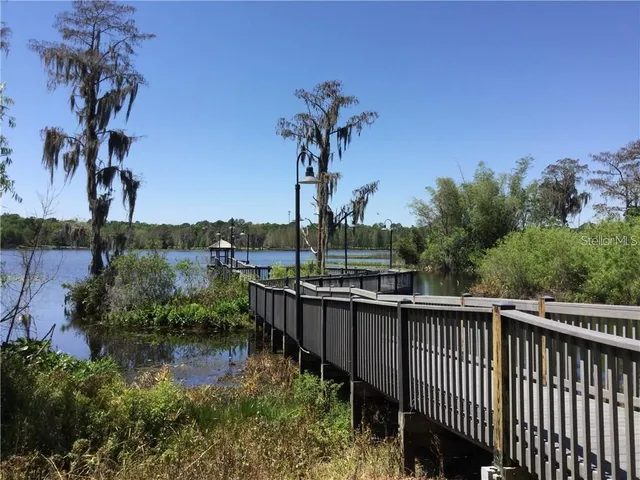a view of a lake with a house in background