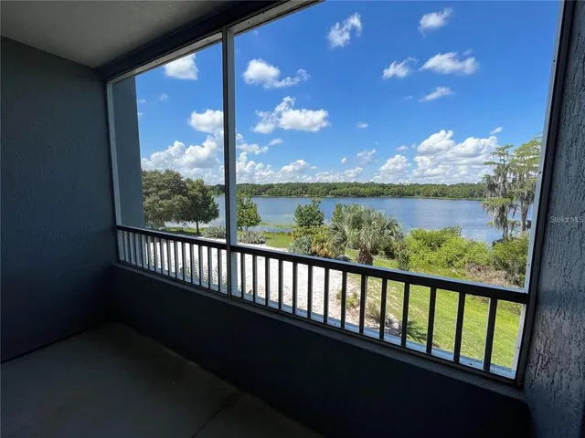 a view of balcony with furniture and city view