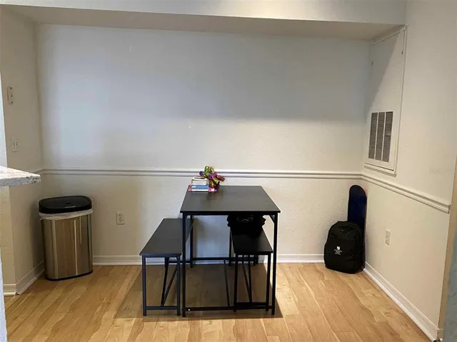 a view of dining room and wooden floor