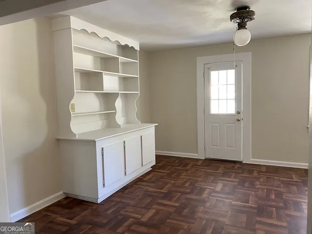 a room with a cabinets and a window