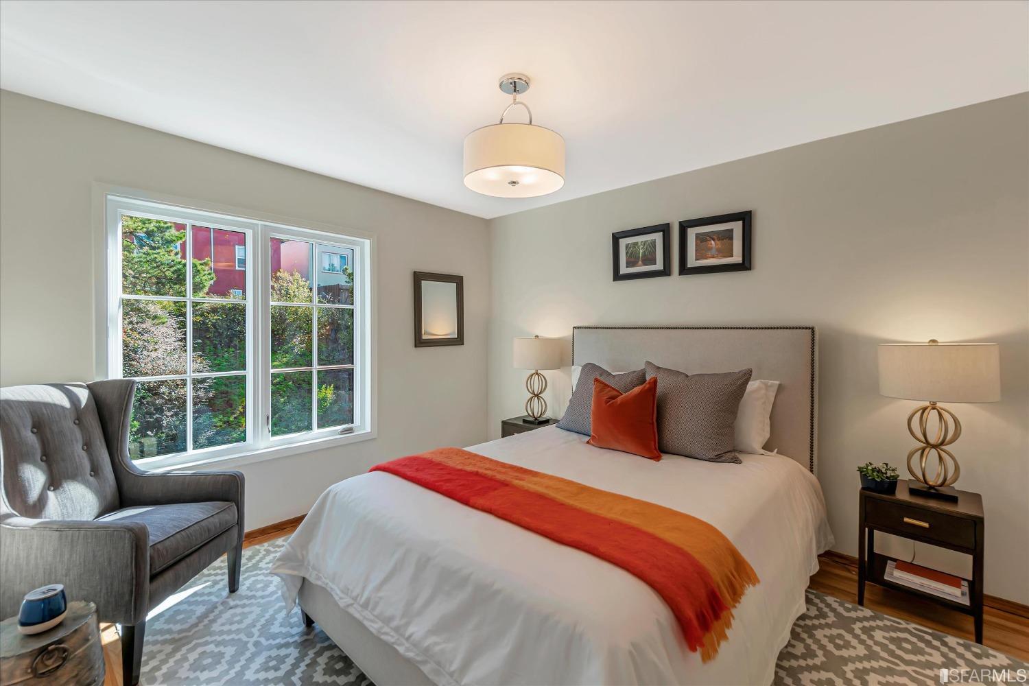 159 Skyview Way San Francisco, CA 94131 - Photo 11 of 17 a bedroom with a bed and a large window