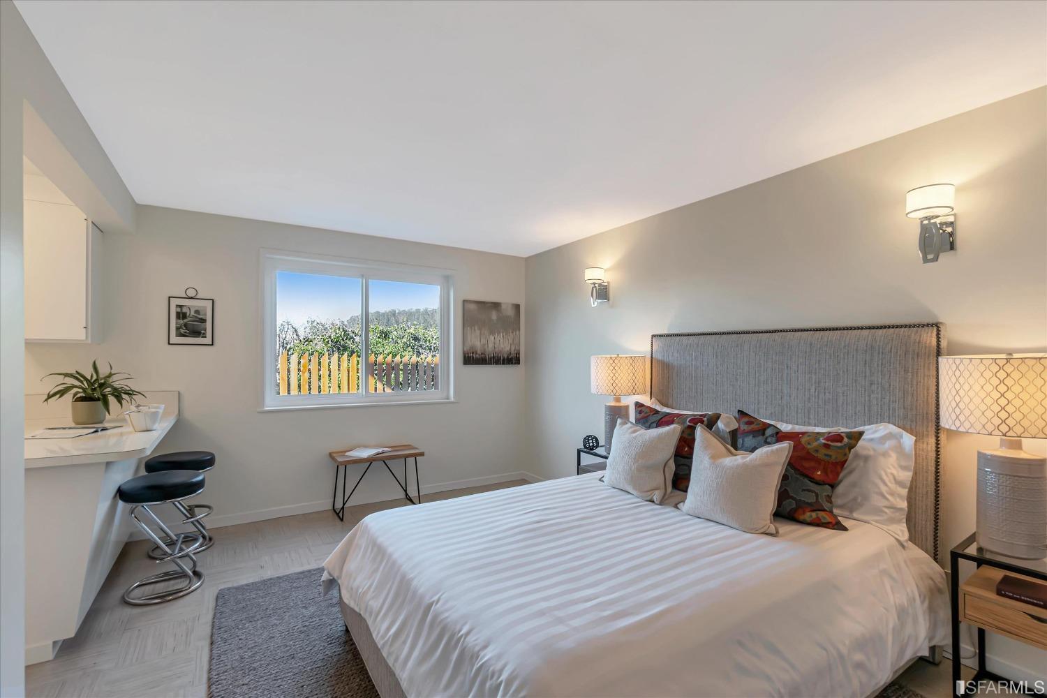 159 Skyview Way San Francisco, CA 94131 - Photo 12 of 17 a bedroom with a bed and a table in it