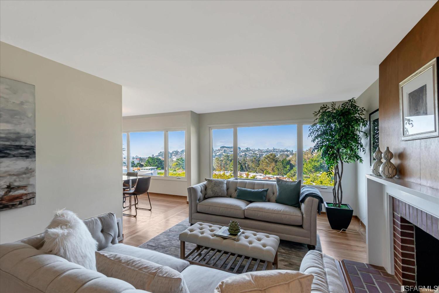 159 Skyview Way San Francisco, CA 94131 - Photo 3 of 17 a living room with furniture and a fireplace