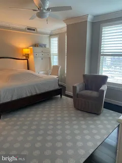 a bedroom with bed and window