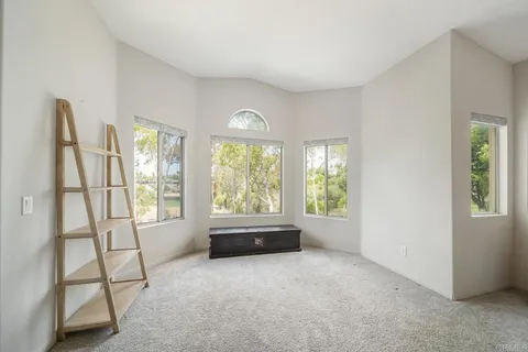 a large bathroom with a large tub and sink