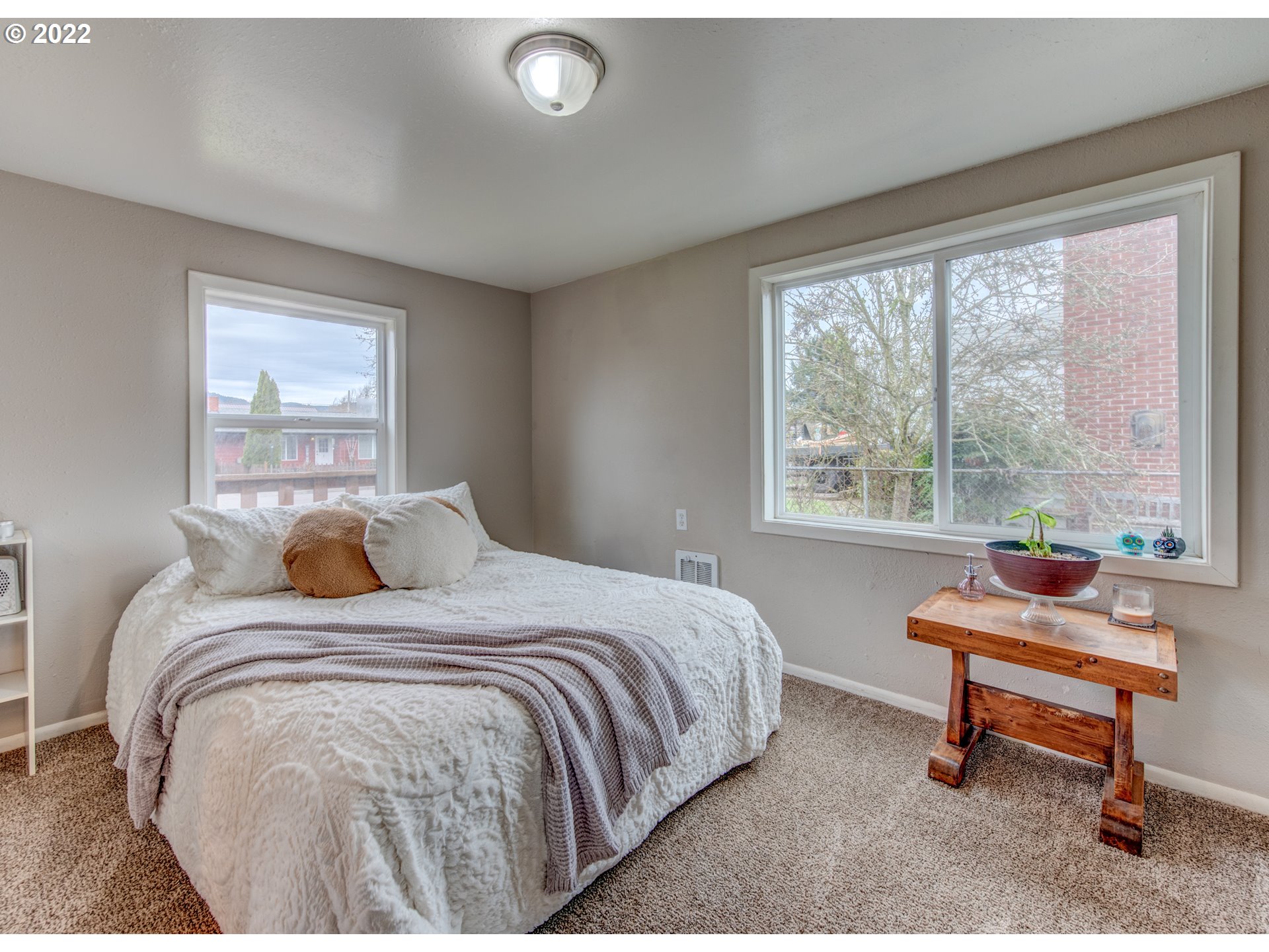 1177 N Street Springfield, OR 97477 - Photo 16 of 30 a bedroom with a bed and a large window