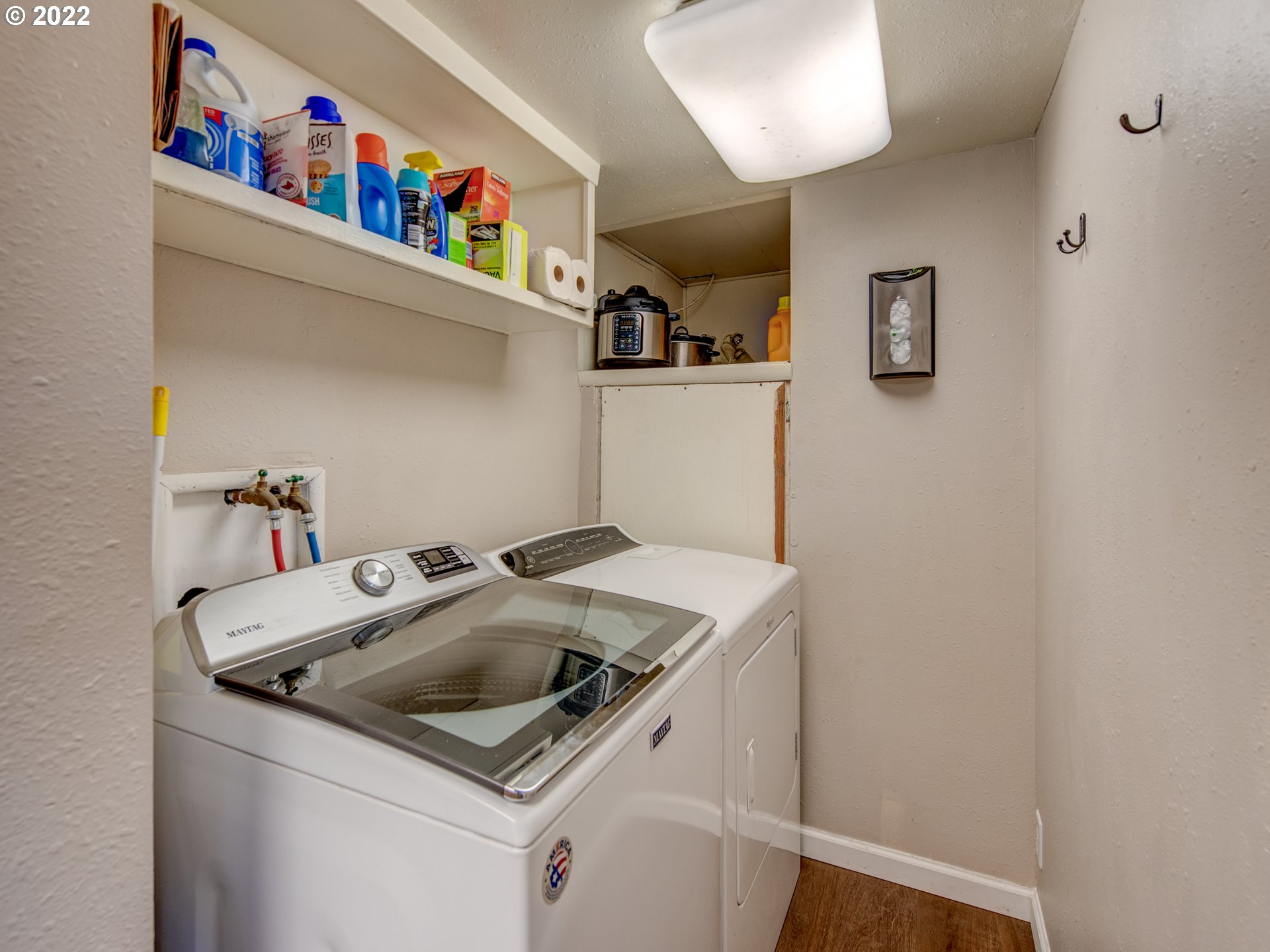 1177 N Street Springfield, OR 97477 - Photo 20 of 30 a utility room with dryer washer and a fridge