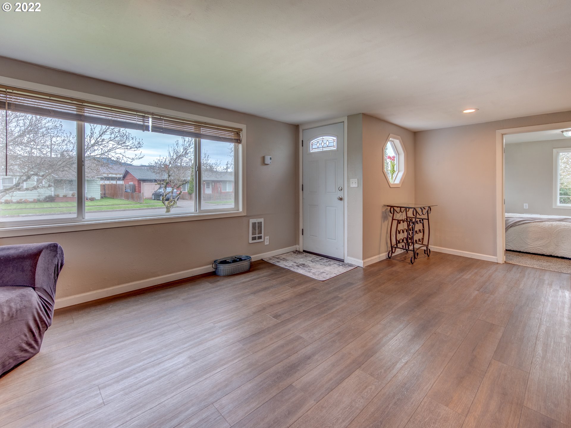 1177 N Street Springfield, OR 97477 - Photo 22 of 30 an empty room with wooden floor and windows
