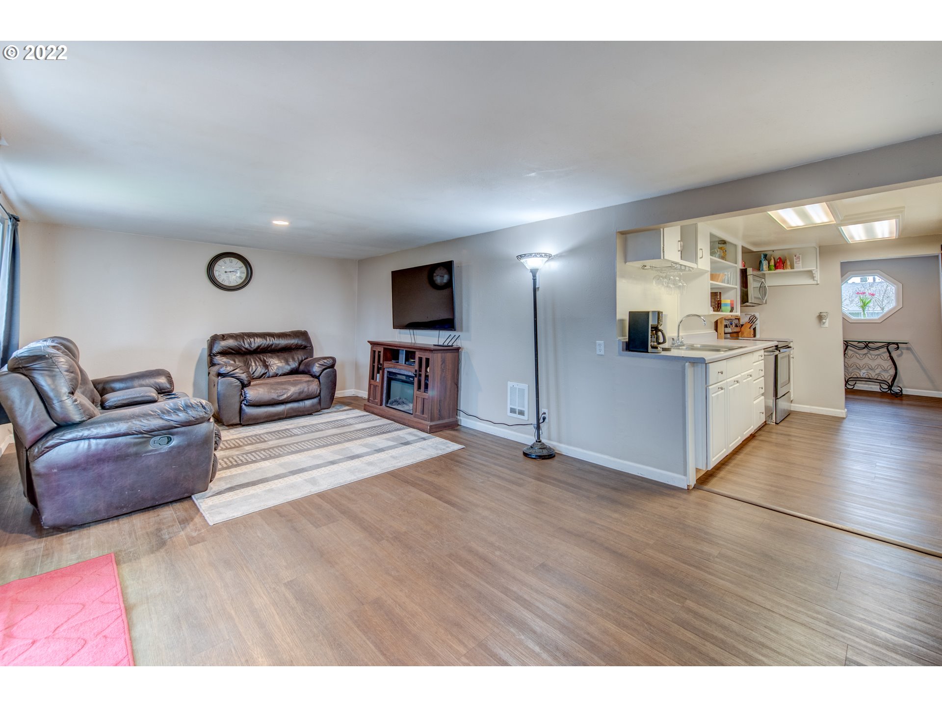 1177 N Street Springfield, OR 97477 - Photo 5 of 30 a view of living room kitchen with furniture and wooden floor
