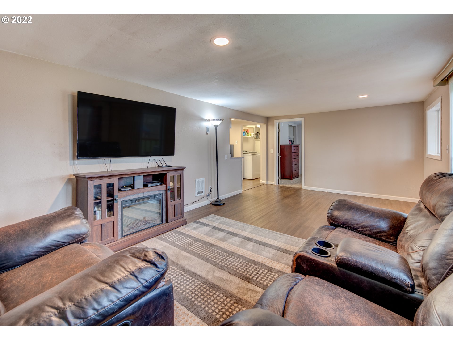 1177 N Street Springfield, OR 97477 - Photo 8 of 30 a living room with furniture and a flat screen tv