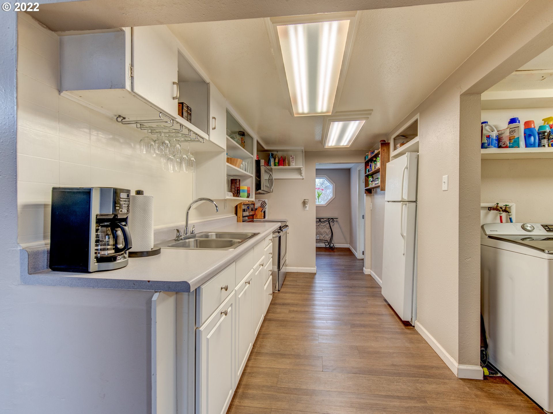 1177 N Street Springfield, OR 97477 - Photo 10 of 30 a kitchen with refrigerator and cabinets