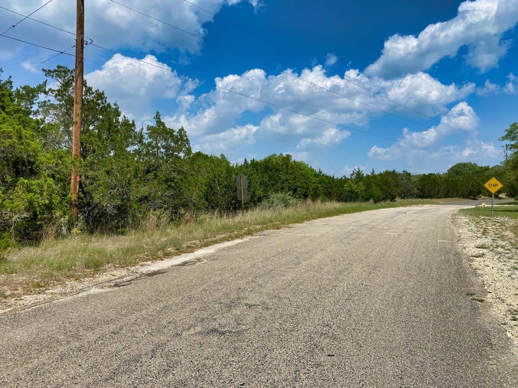 502-532 Oak Country Way Helotes, TX 78023 - Photo 6 of 11 a view of a lake with houses in the back