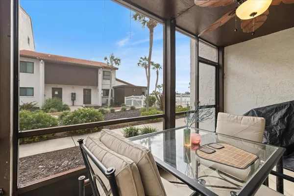 a view of balcony with furniture and wooden floor