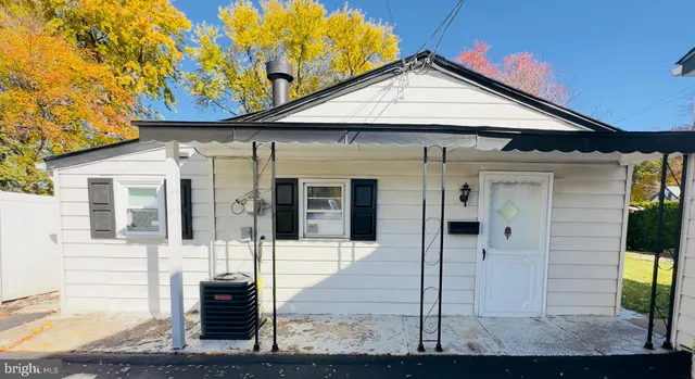 a front view of a house with glass windows