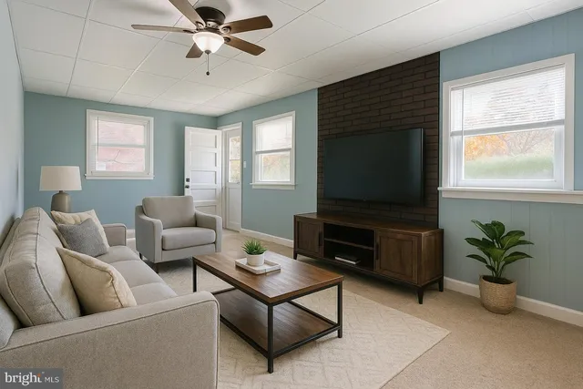 a living room with furniture and a flat screen tv