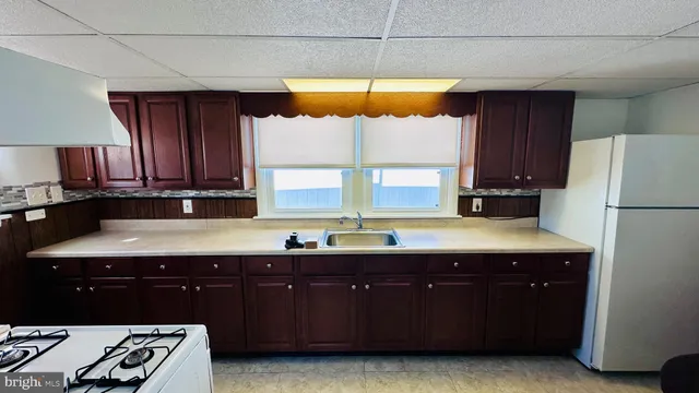 a kitchen with a sink and a window