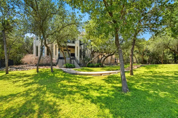 a view of a backyard with swimming pool