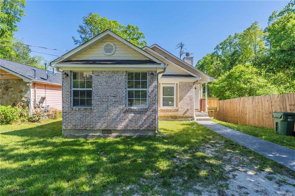2212 Butner Road Atlanta, GA 30331 - Photo 1 of 1 a front view of a house with a yard