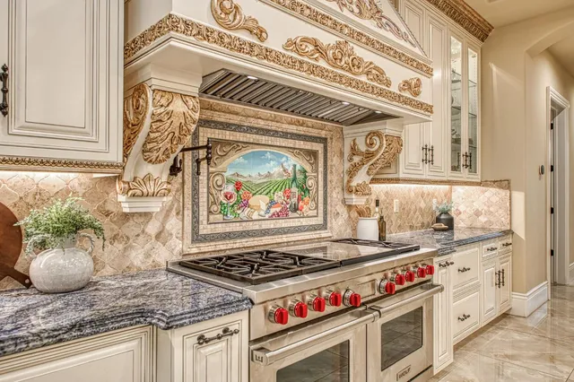a kitchen with a stove and a white cabinet